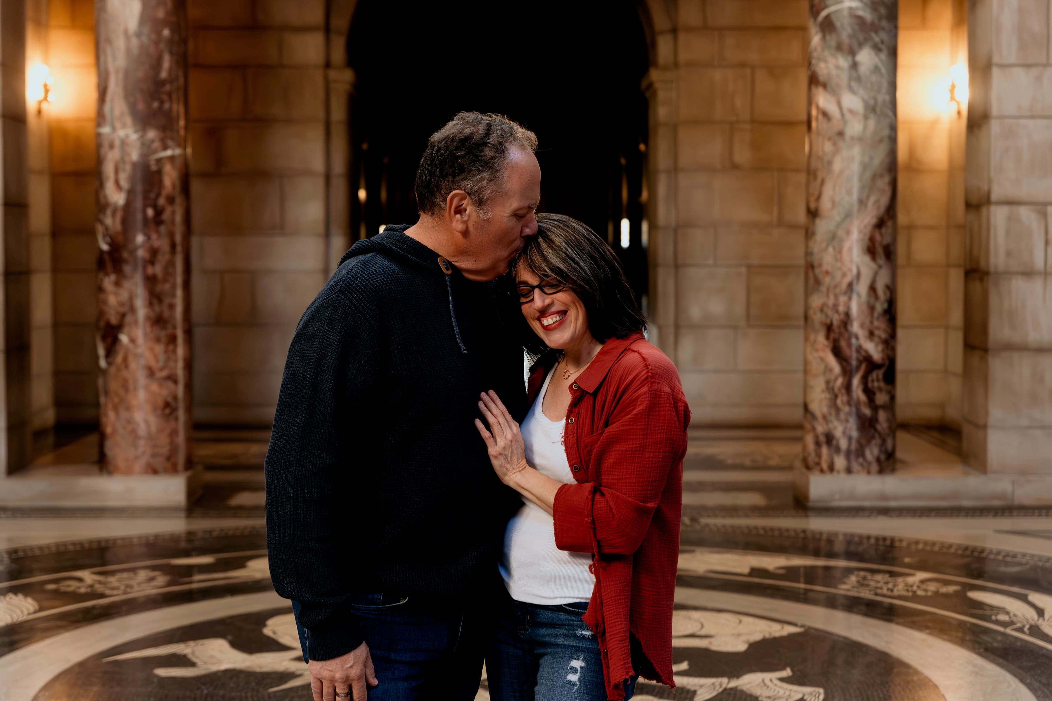 Jamie kissing Cindy’s forehead inside the Wisconsin State Capitol